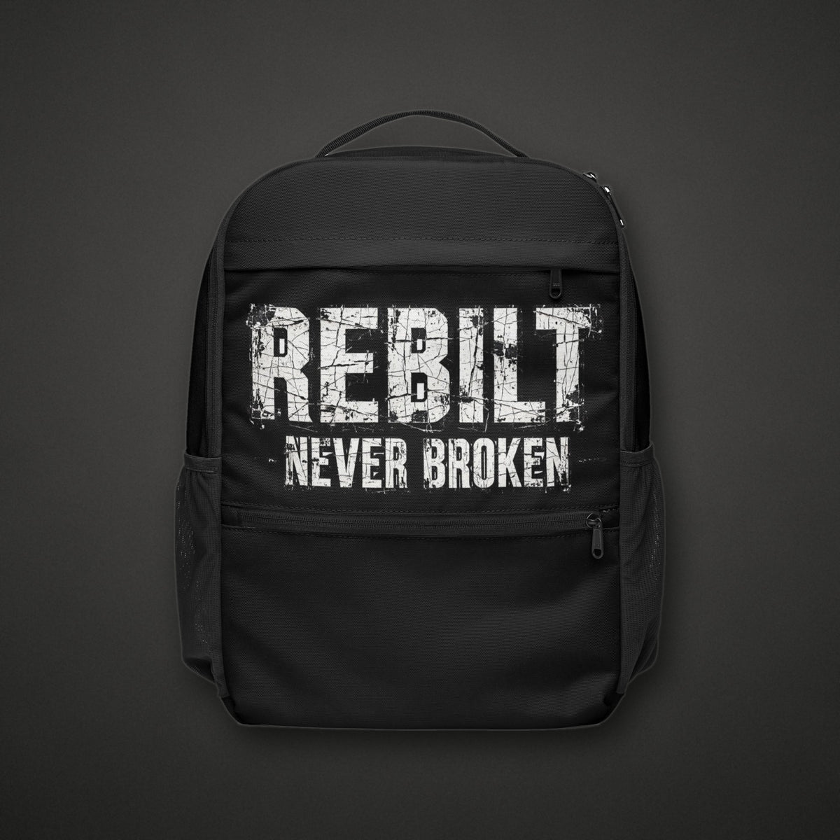 REBILT Never Broken Utility Backpack on dark background