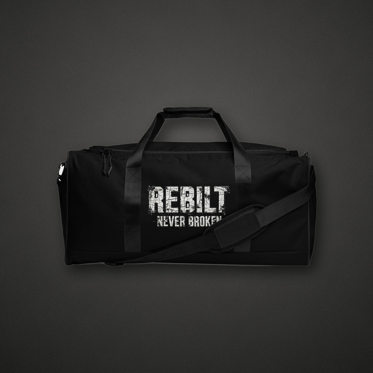 REBILT Never Broken Duffle Bag on dark background