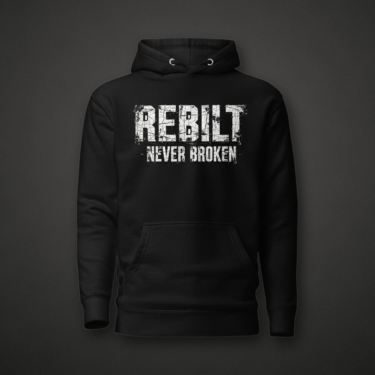 REBILT Never Broken Distressed Hoodie on dark background