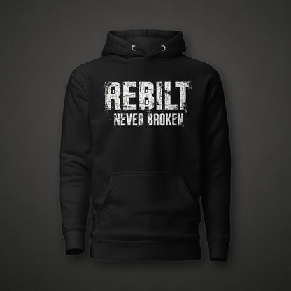 REBILT Never Broken Distressed Hoodie on dark background