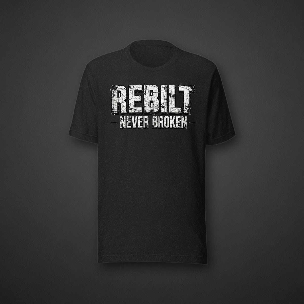 REBILT Never Broken Distressed Tee on dark background
