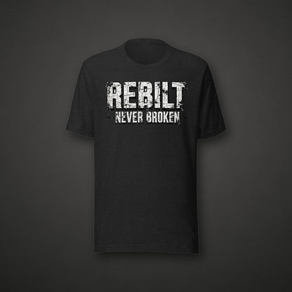 REBILT Never Broken Distressed Tee on dark background