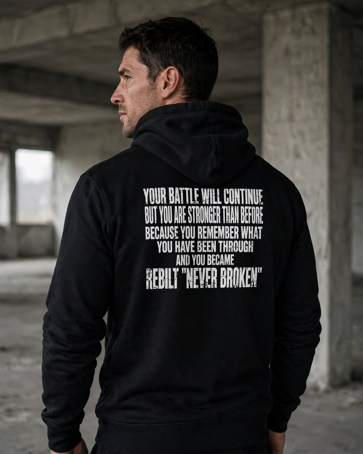 Back of the REBILT Distressed Hoodie in Black showing the Your Battle Will Continue back print