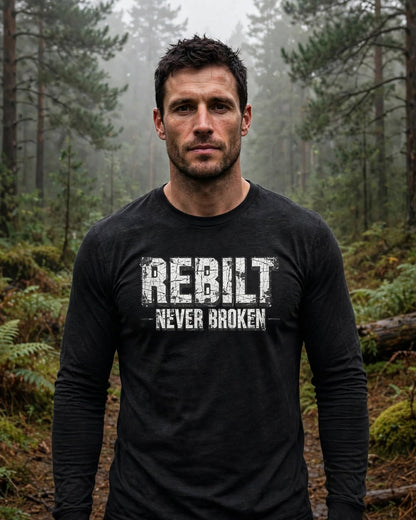 Man wearing the REBILT Never Broken Long Sleeve Tee in Black Heather, front logo